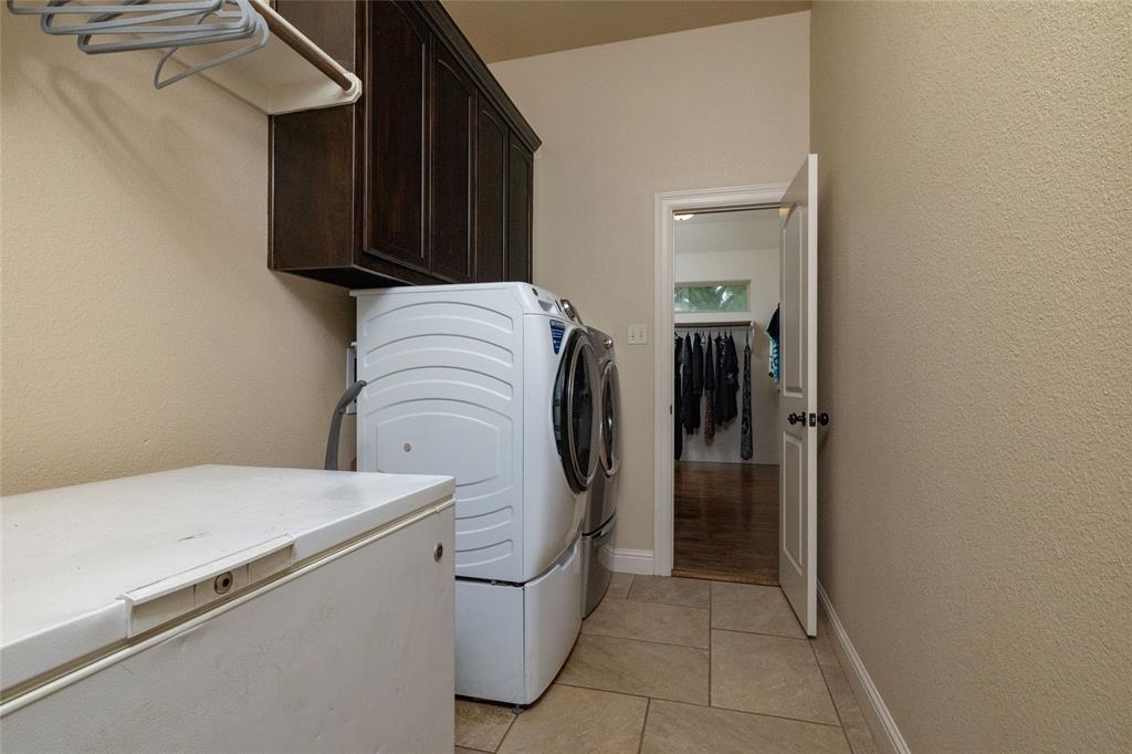 208 Ellis Creek Drive Weatherford, TX 76085 - Photo 31 of 40 a utility room with dryer and washer