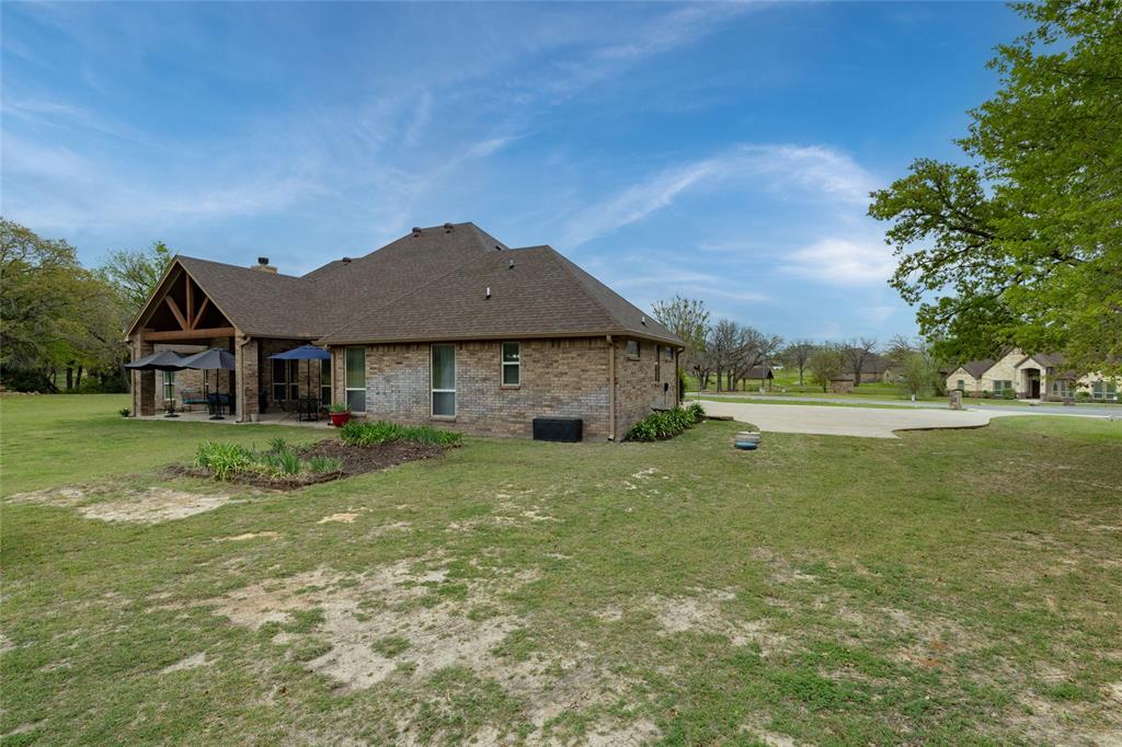 208 Ellis Creek Drive Weatherford, TX 76085 - Photo 35 of 40 a view of a house with a big yard