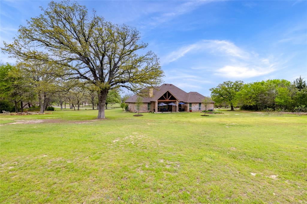 208 Ellis Creek Drive Weatherford, TX 76085 - Photo 37 of 40 a front view of house with yard and green space