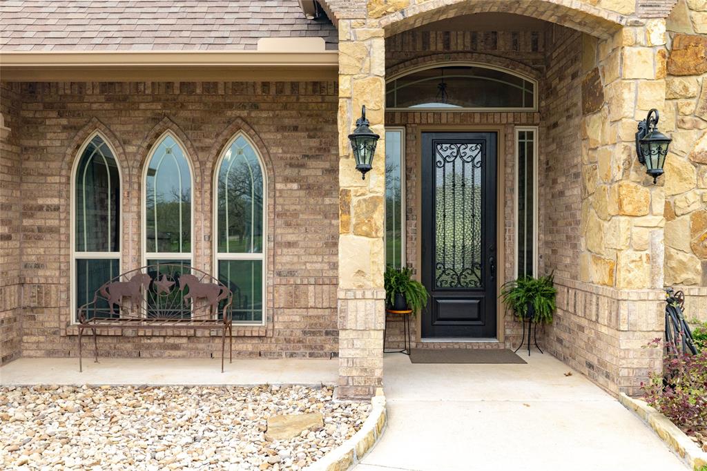 208 Ellis Creek Drive Weatherford, TX 76085 - Photo 6 of 40 a front view of a house with garden