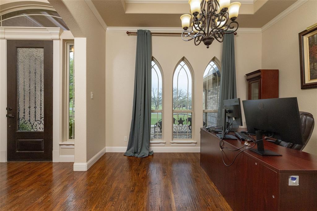 208 Ellis Creek Drive Weatherford, TX 76085 - Photo 10 of 40 a view of a livingroom with workspace and a window