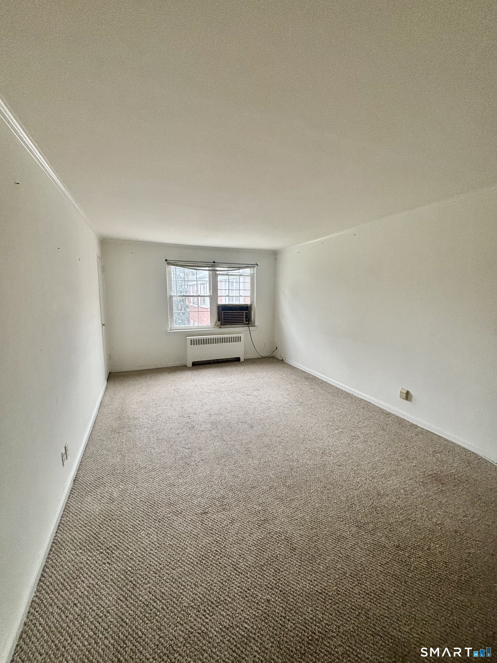 74 Standish Road, Unit 3 Stamford, CT 06902 - Photo 20 of 22 a view of an empty room with a window
