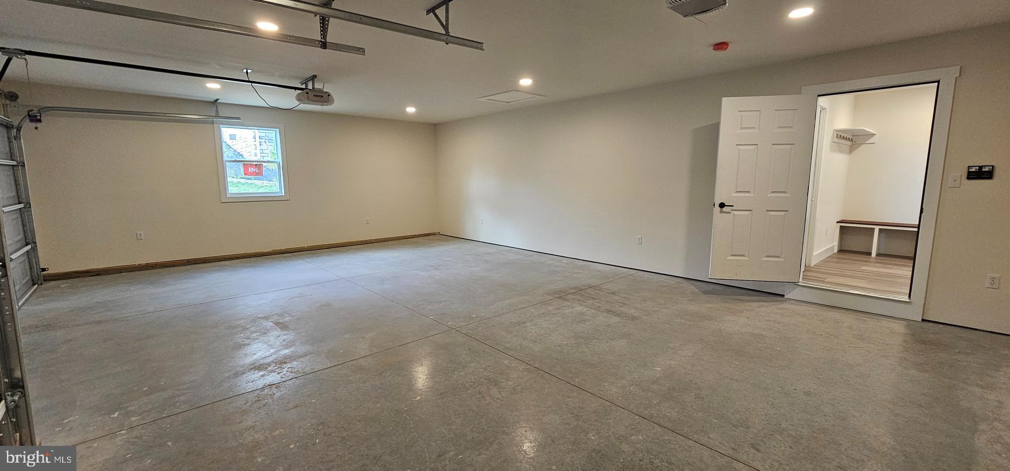 154 Saffron Boulevard Centre Hall, PA 16828 - Photo 25 of 57 an empty room with windows and entrance