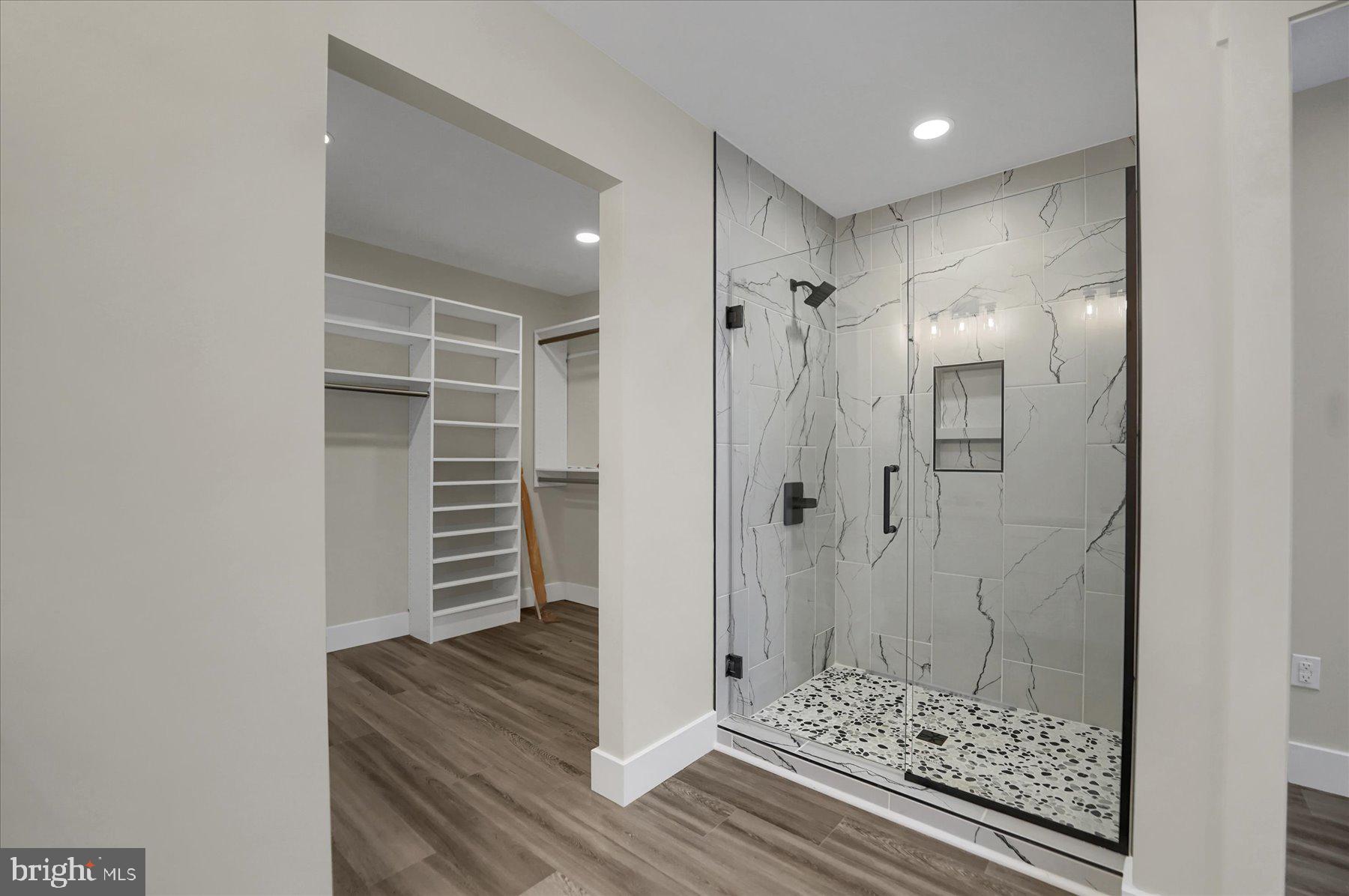 154 Saffron Boulevard Centre Hall, PA 16828 - Photo 34 of 57 a view of room with walk in closet and wooden floor