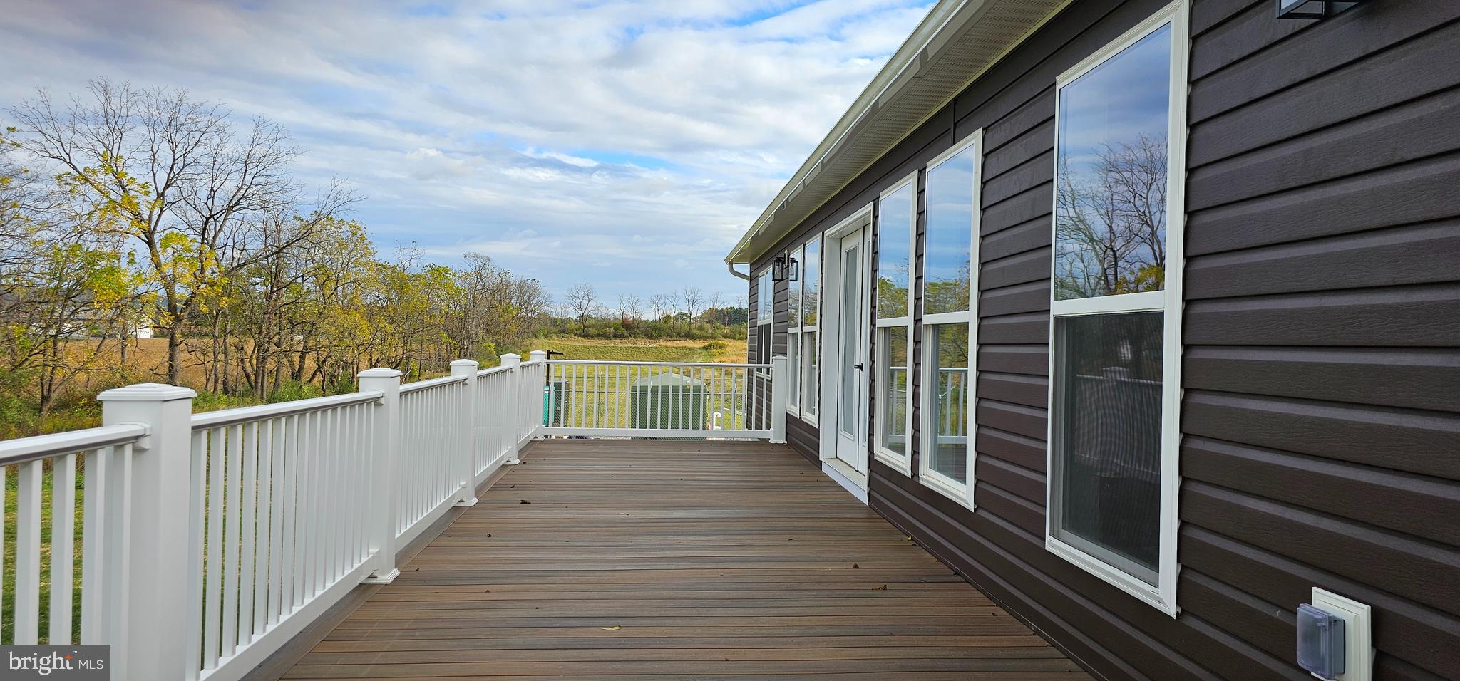 154 Saffron Boulevard Centre Hall, PA 16828 - Photo 10 of 57 a view of a balcony with wooden floor and fence