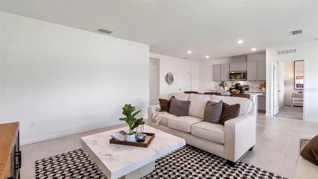 a living room with furniture and a couch