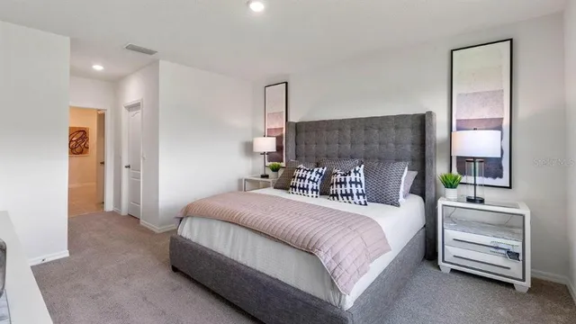 a bedroom with a bed and a dresser