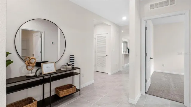 a view of an entryway with sitting space and mirror