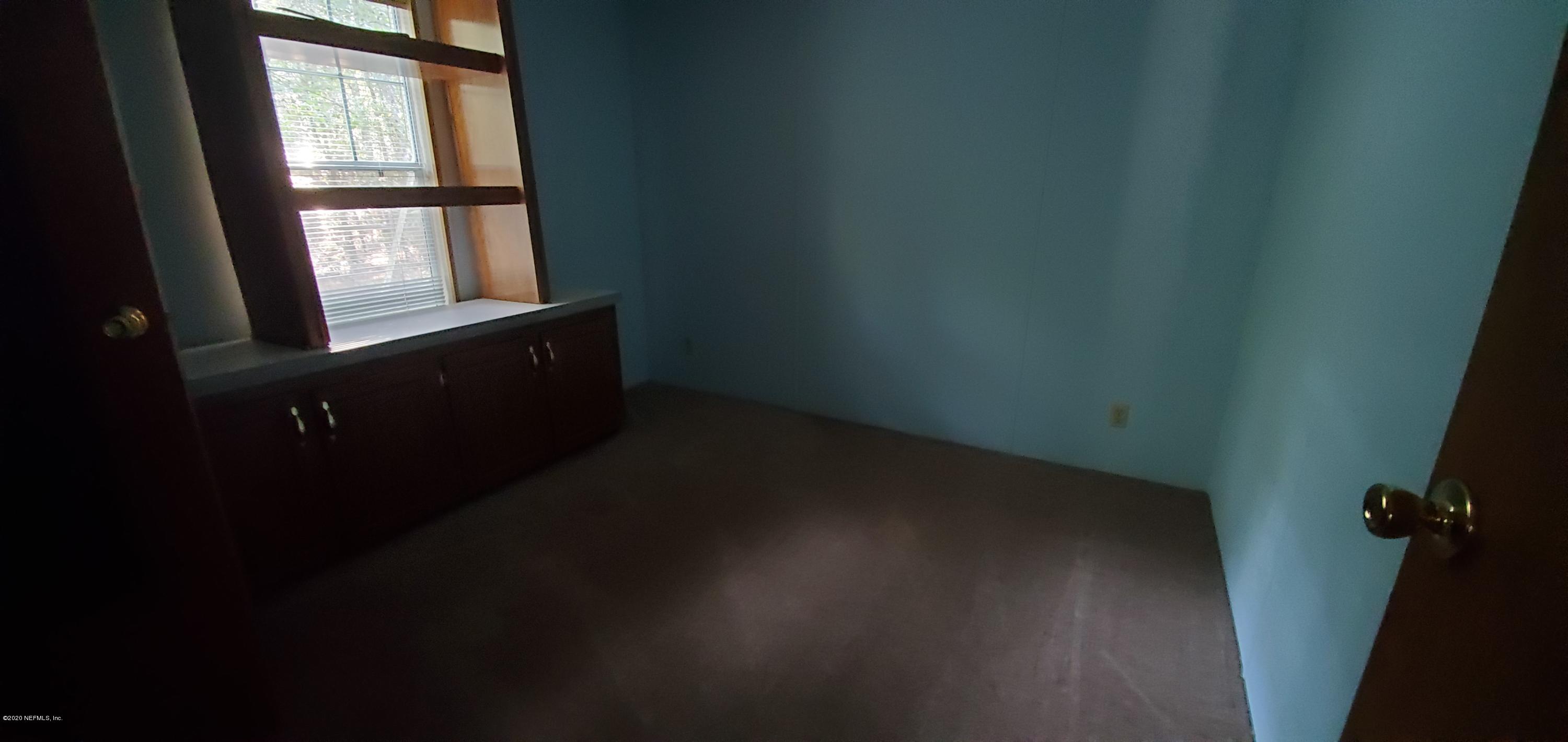 8917 Noroad, Unit 37 Jacksonville, FL 32210 - Photo 11 of 15 a view of an empty room and window