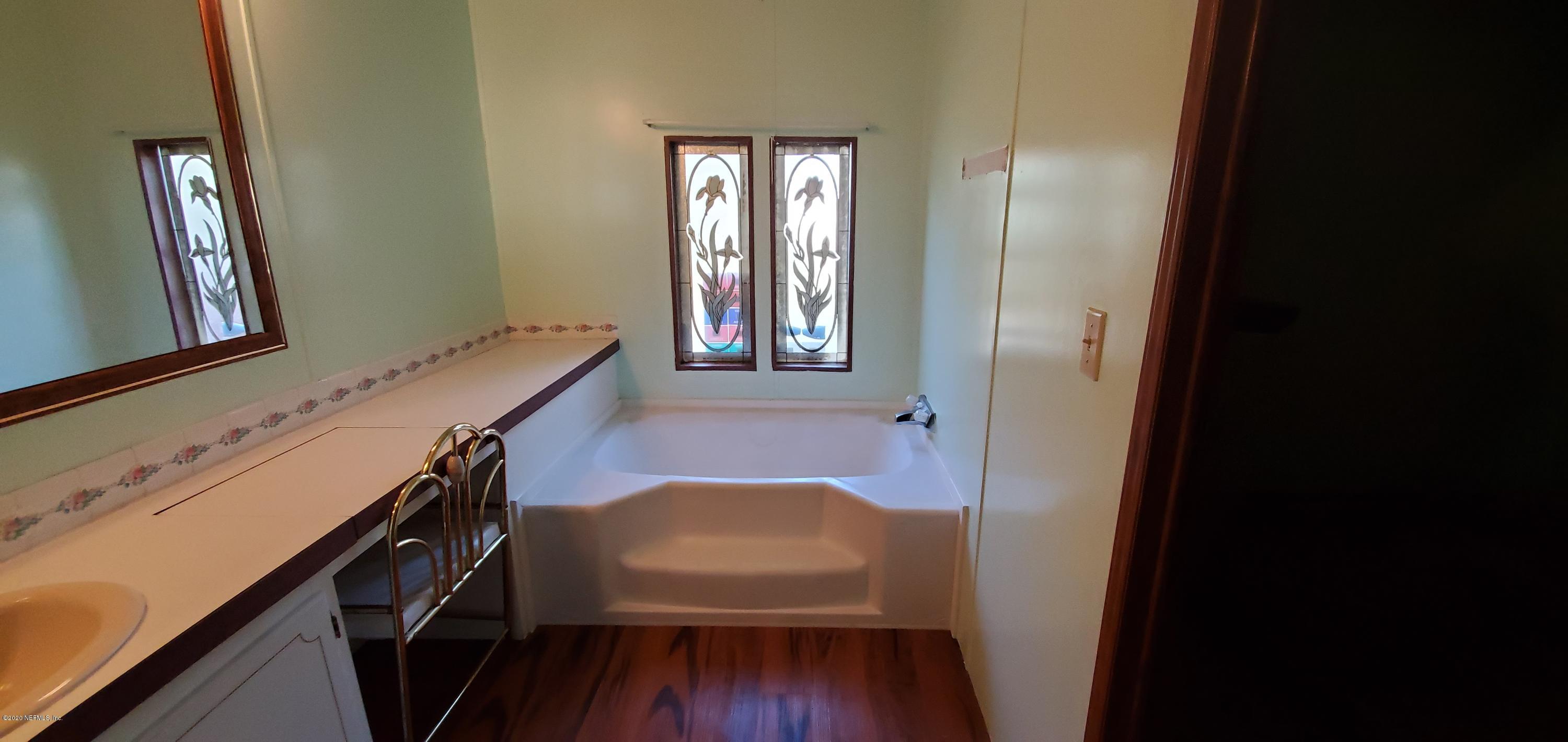 8917 Noroad, Unit 37 Jacksonville, FL 32210 - Photo 15 of 15 a view of a hallway and a livingroom with furniture