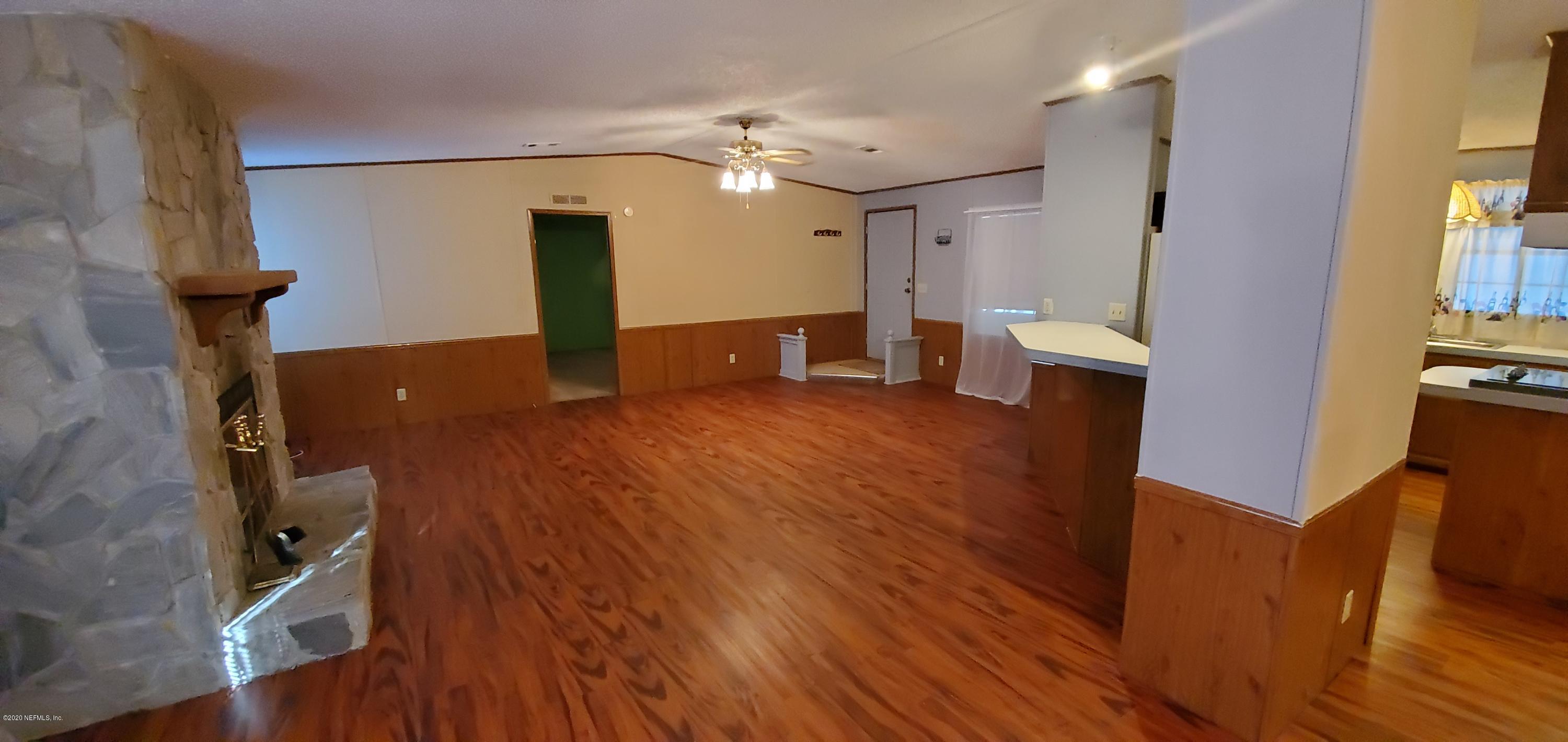 8917 Noroad, Unit 37 Jacksonville, FL 32210 - Photo 6 of 15 a view of a living room and wooden floor