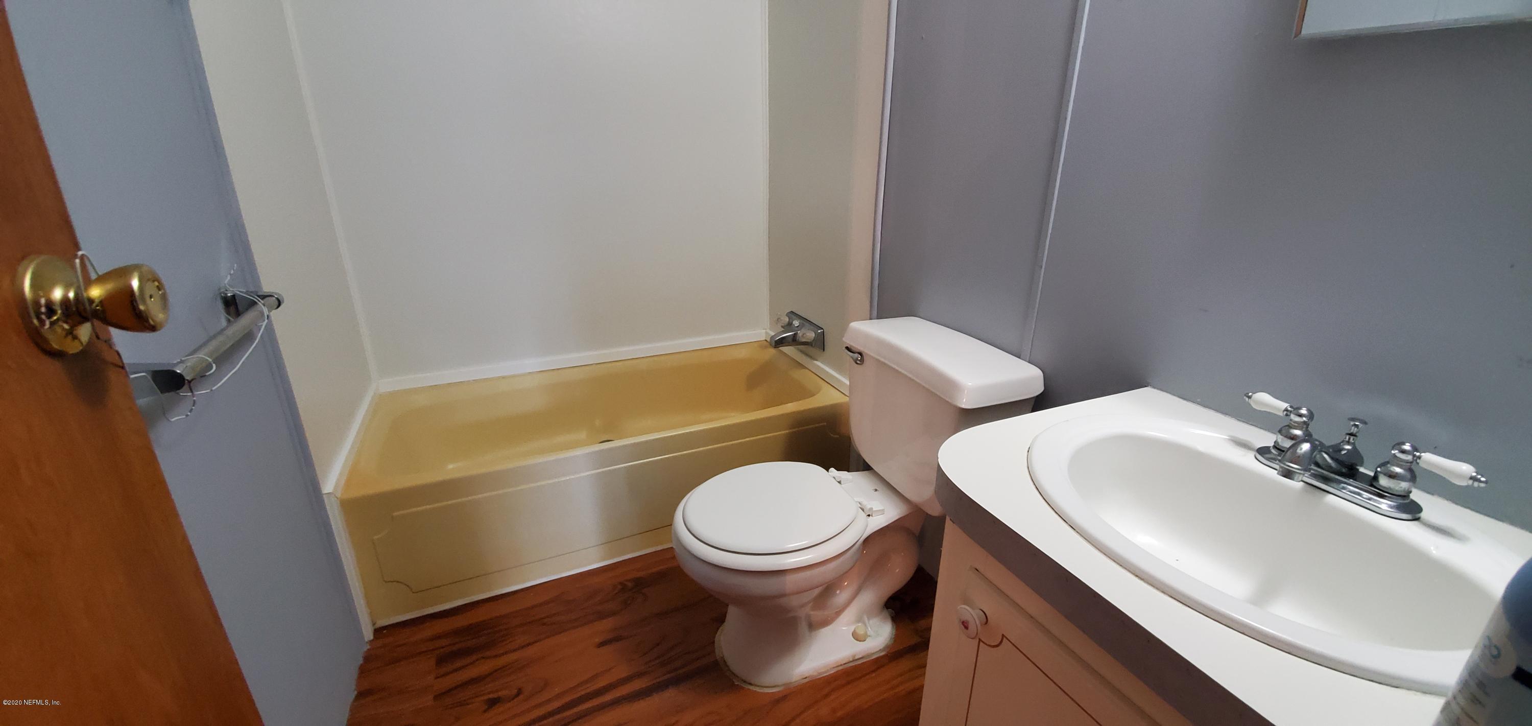 8917 Noroad, Unit 37 Jacksonville, FL 32210 - Photo 9 of 15 a bathroom with a sink and a toilet