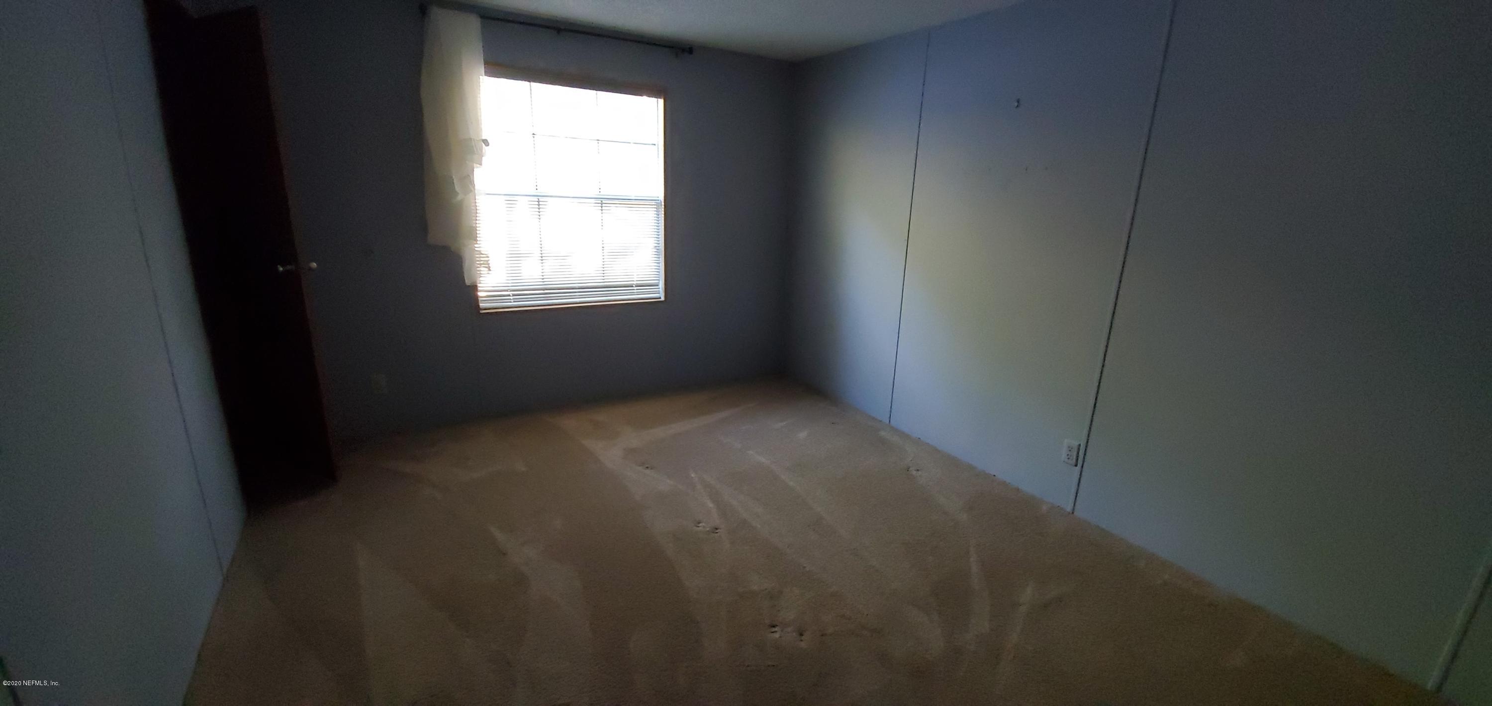 8917 Noroad, Unit 37 Jacksonville, FL 32210 - Photo 10 of 15 a view of an empty room with a window