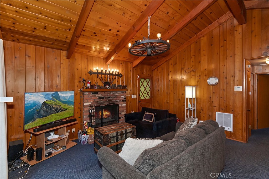 558 Rose Twin Peaks, CA 92391 - Photo 13 of 31 a living room with furniture a flat screen tv and a fireplace