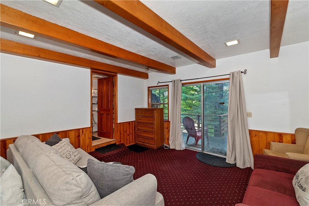 558 Rose Twin Peaks, CA 92391 - Photo 20 of 31 a bedroom with furniture and a window