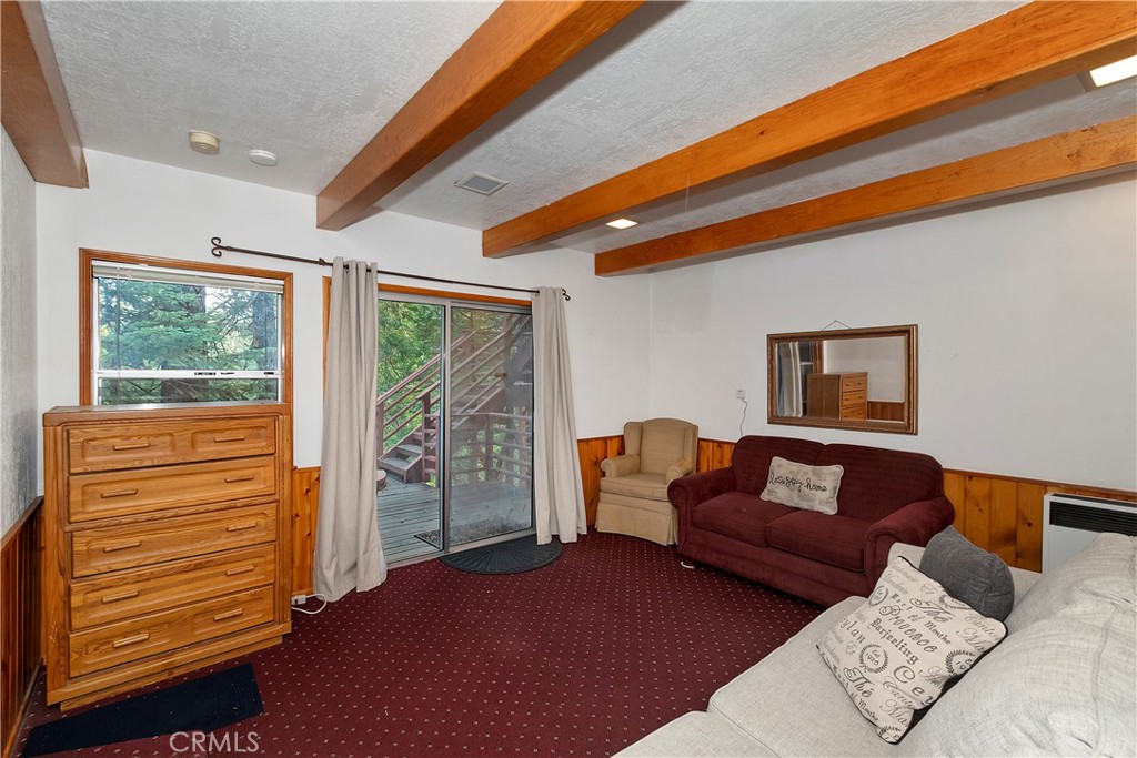 558 Rose Twin Peaks, CA 92391 - Photo 21 of 31 a living room with furniture and a window