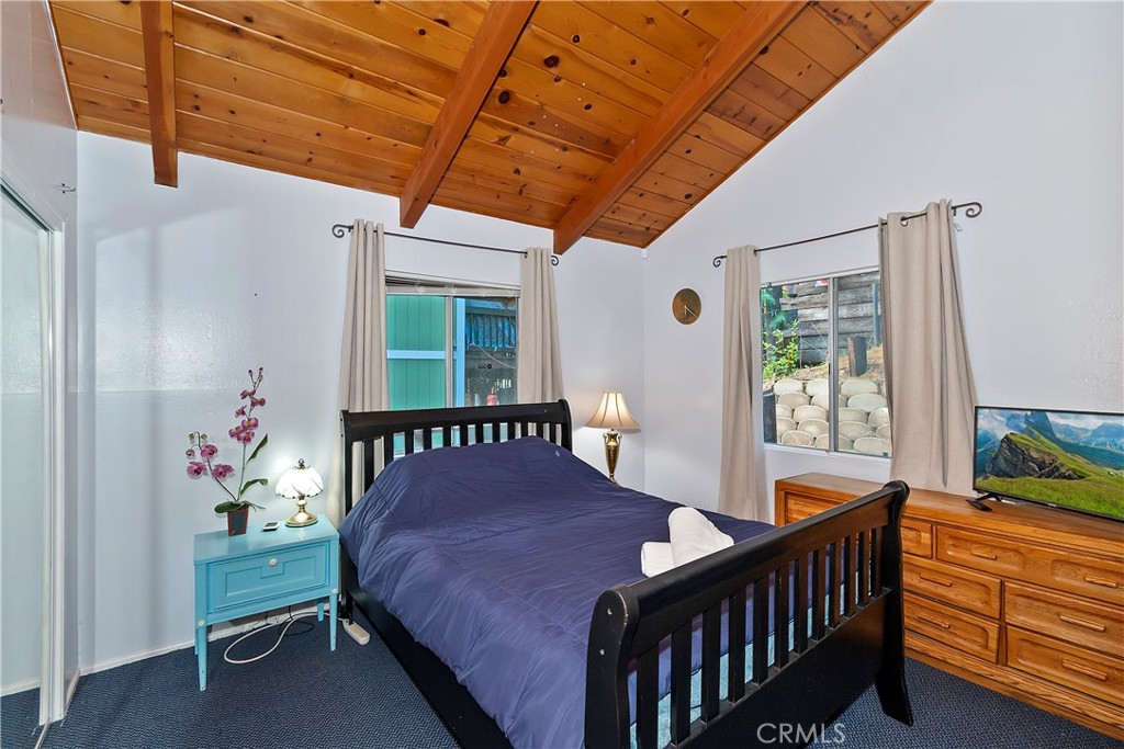 558 Rose Twin Peaks, CA 92391 - Photo 5 of 31 a bedroom with a bed and a window