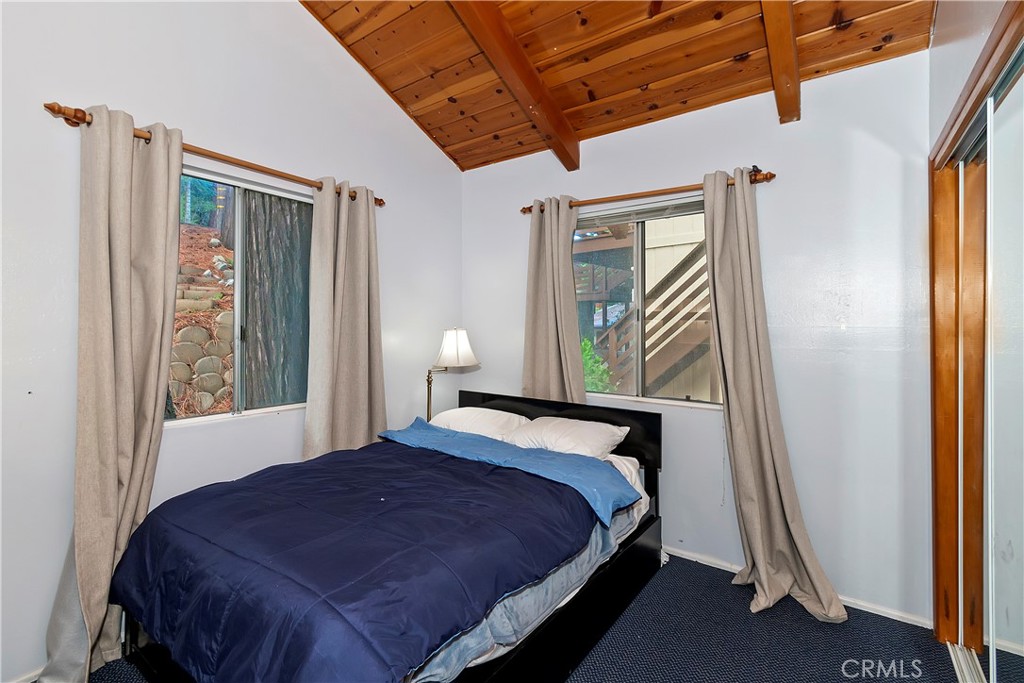 558 Rose Twin Peaks, CA 92391 - Photo 7 of 31 a bedroom with a bed and a window
