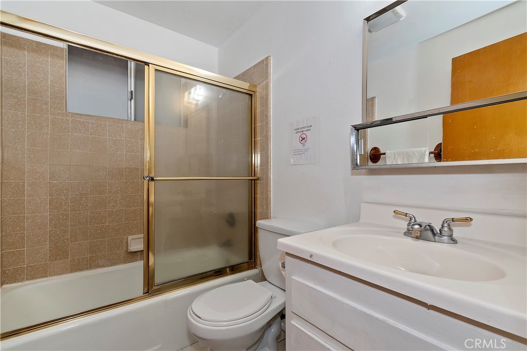 558 Rose Twin Peaks, CA 92391 - Photo 9 of 31 a bathroom with a sink toilet and shower