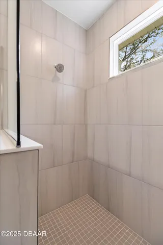 a bathroom with double sink and a mirror
