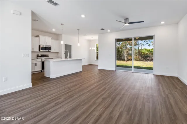 a view of kitchen with stainless steel appliances refrigerator oven and stove