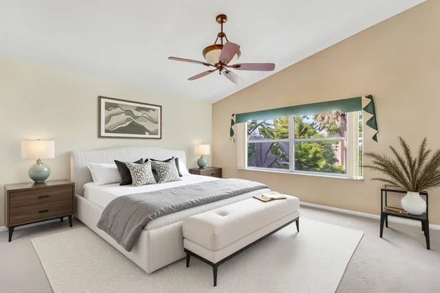 a bedroom with a large bed and a window