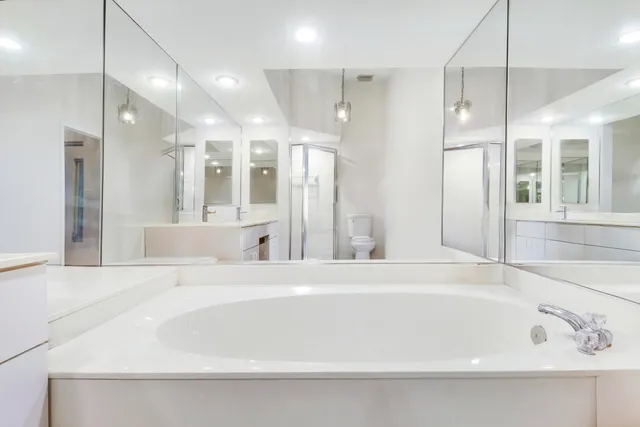 a bathroom with a bathtub and a shower