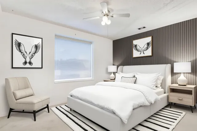 a bedroom with double bed and a window