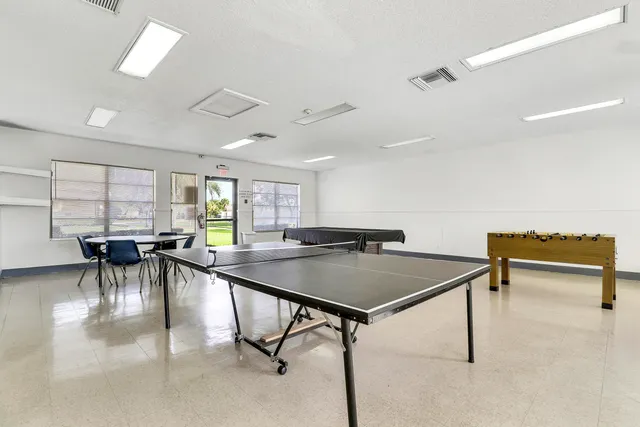a view of a dining room with furniture and a table