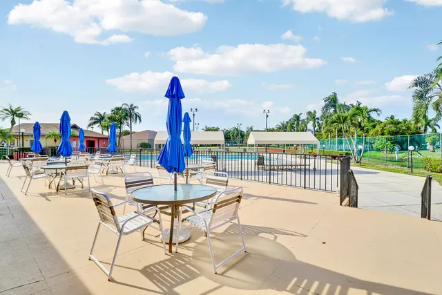 a view of a swimming pool with a lounge chairs