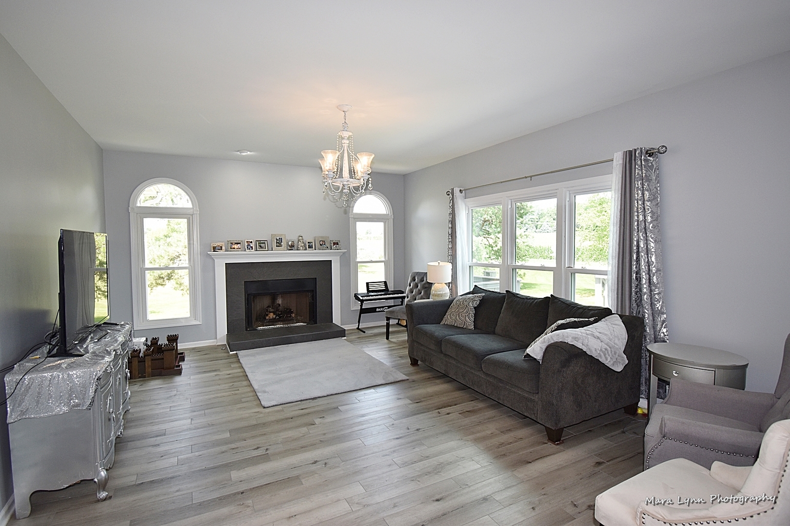 930 Merrill New Road Sugar Grove, IL 60554 - Photo 14 of 34 a living room with furniture and a fireplace