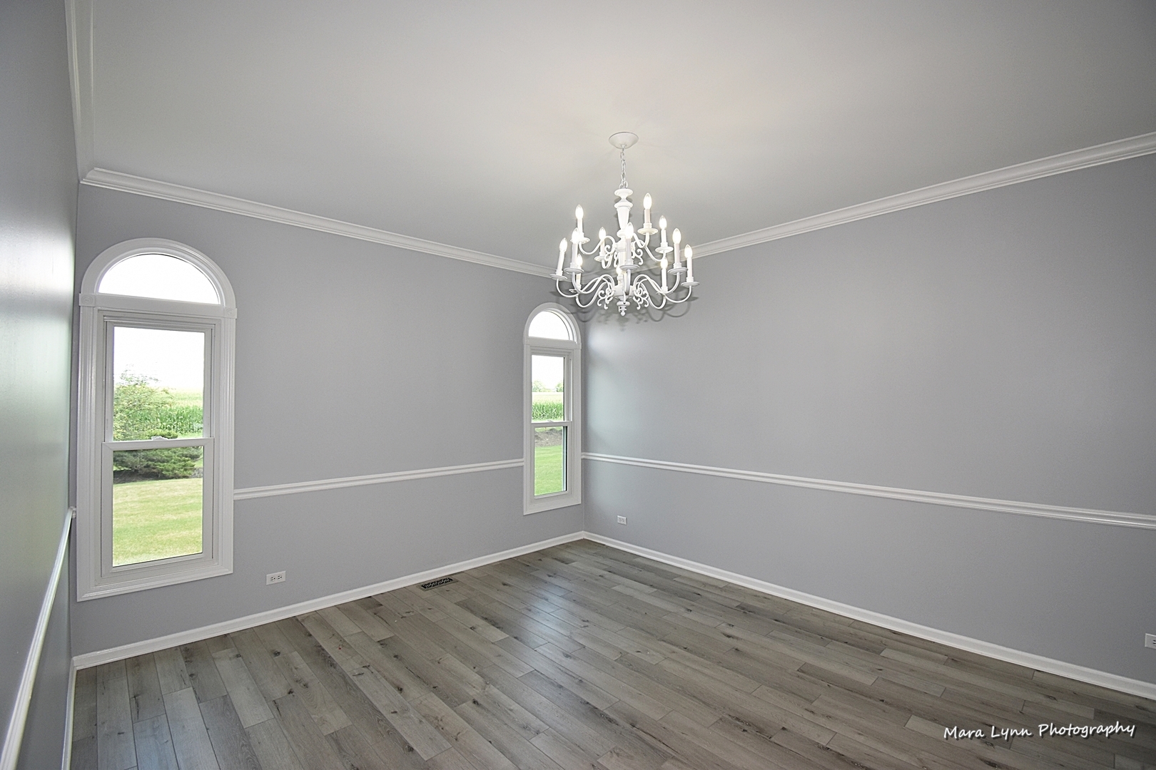 930 Merrill New Road Sugar Grove, IL 60554 - Photo 8 of 34 a view of empty room with wooden floor and fan