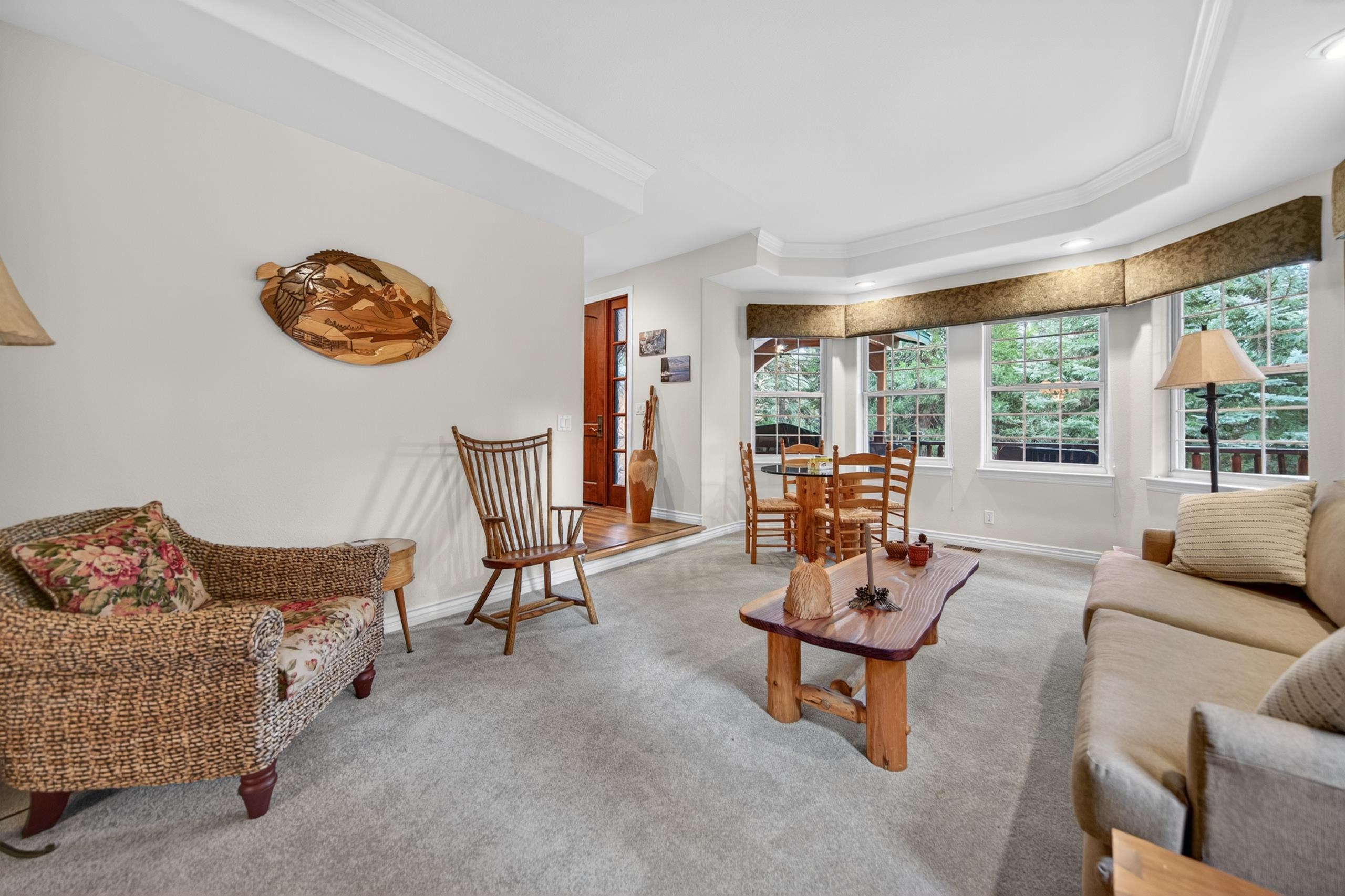 1017 Timber Ridge Road Lake Almanor, CA 96137 - Photo 8 of 45 a living room with furniture and a large window