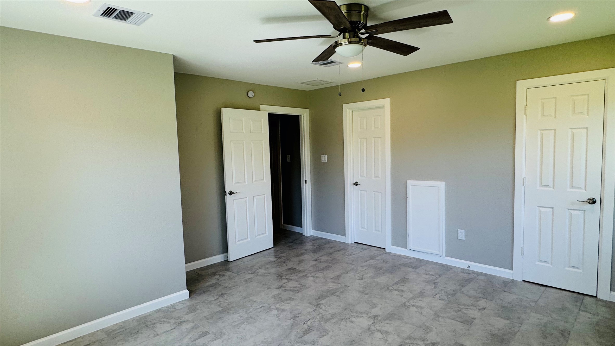 1434 County Road 878A Sweeny, TX 77480 - Photo 26 of 36 a view of a hallway with a ceiling fan and wooden floor