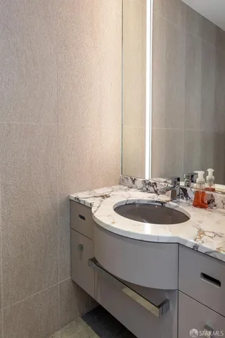 a bathroom with a sink and a white vanity