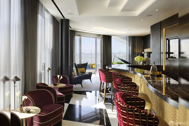 a room with furniture or couch and a potted plant