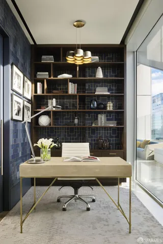 a view of a workspace with furniture