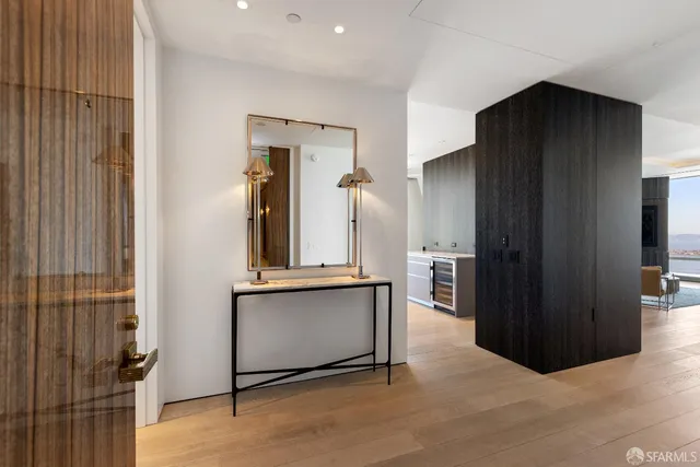 a living room with stainless steel appliances kitchen island granite countertop furniture and a window