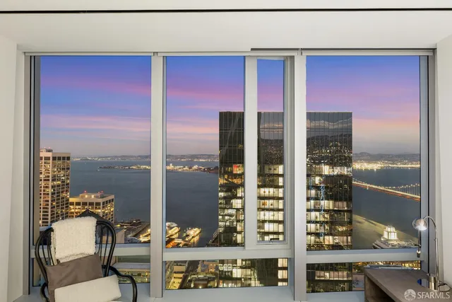 a view of a balcony with chairs