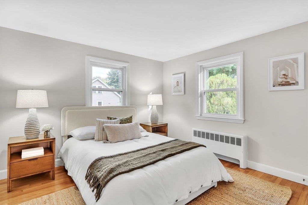 46 Middle Street Lexington, MA 02421 - Photo 11 of 33 a bedroom with a bed and a window