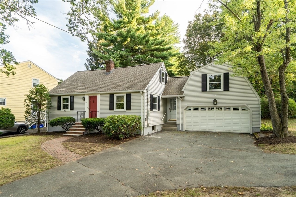 46 Middle Street Lexington, MA 02421 - Photo 2 of 33 a front view of a house with a garden