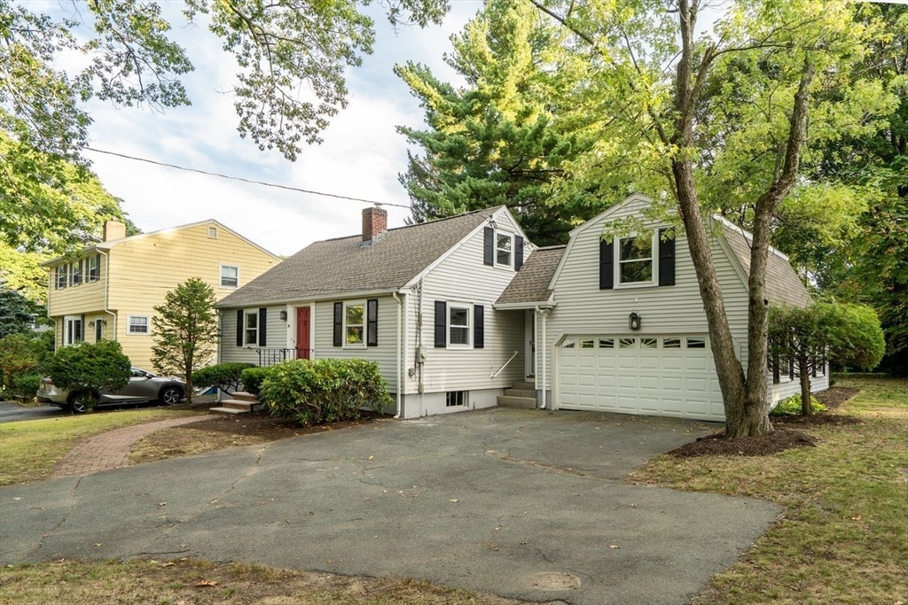 46 Middle Street Lexington, MA 02421 - Photo 3 of 33 a front view of a house with a garden