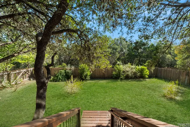 a backyard of a house with lots of green space