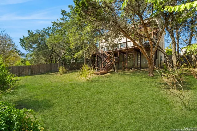 a view of backyard with green space