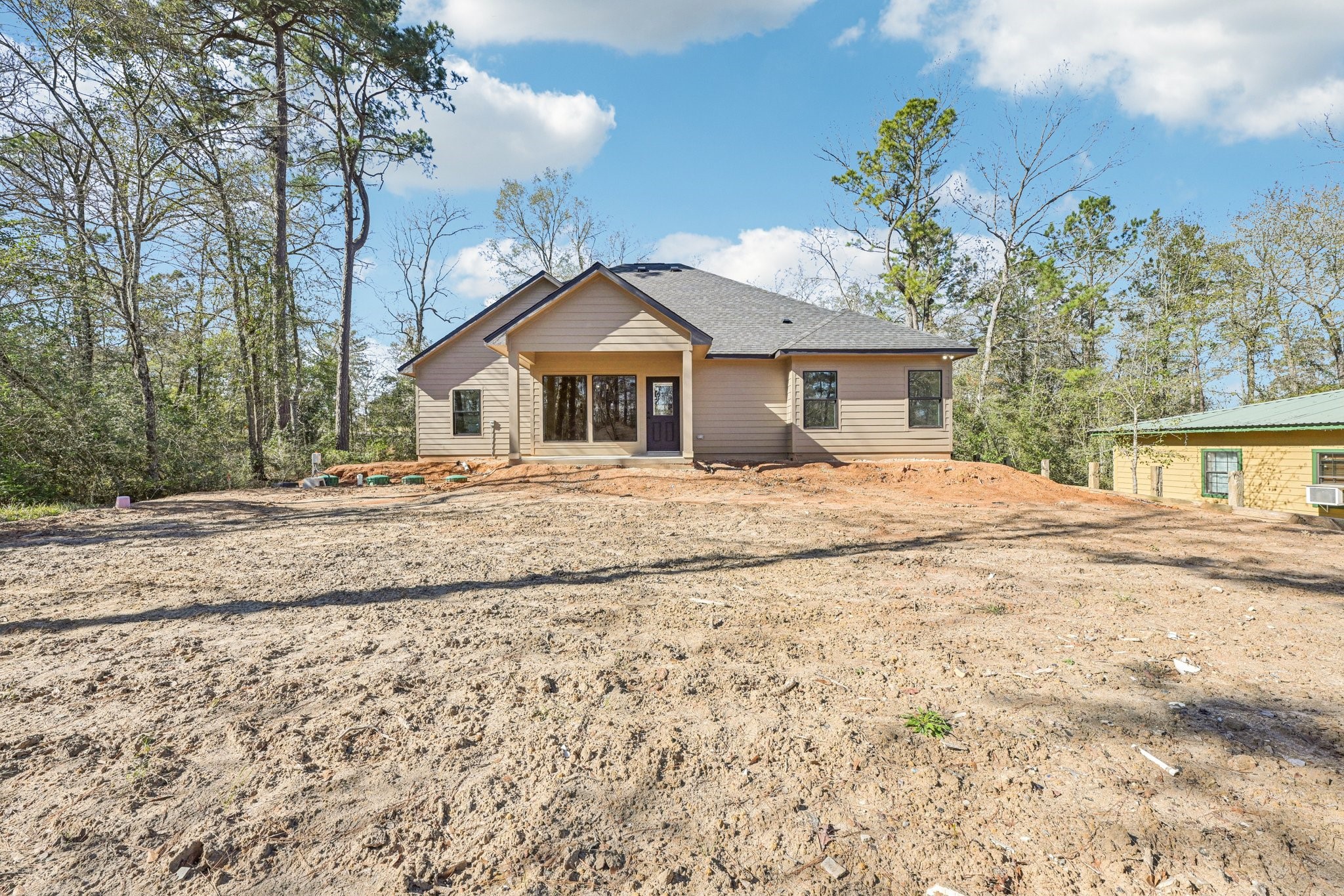15132 Coaltown Road Willis, TX 77378 - Photo 30 of 30 a view of a house with a yard covered in snow
