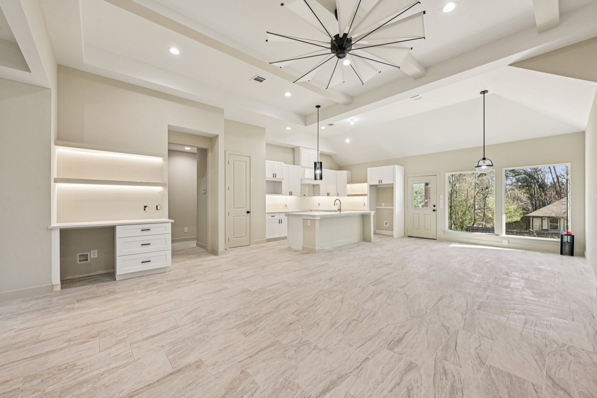 15132 Coaltown Road Willis, TX 77378 - Photo 7 of 30 a large white room with a large window and a ceiling fan