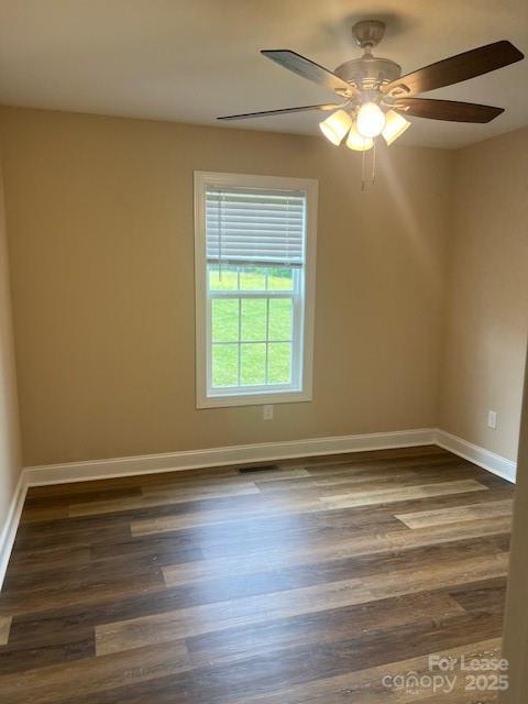142 Dove Meadow Lane Statesville, NC 28625 - Photo 6 of 9 a view of empty room with wooden floor and fan