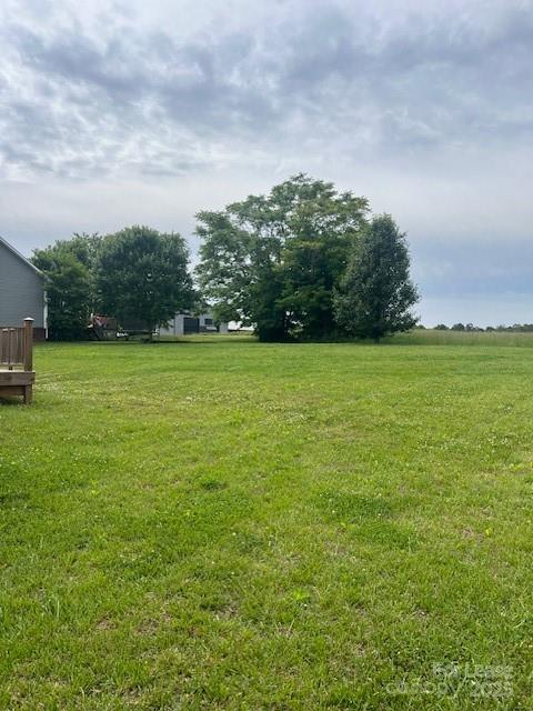 142 Dove Meadow Lane Statesville, NC 28625 - Photo 9 of 9 a view of a green field with wooden fence