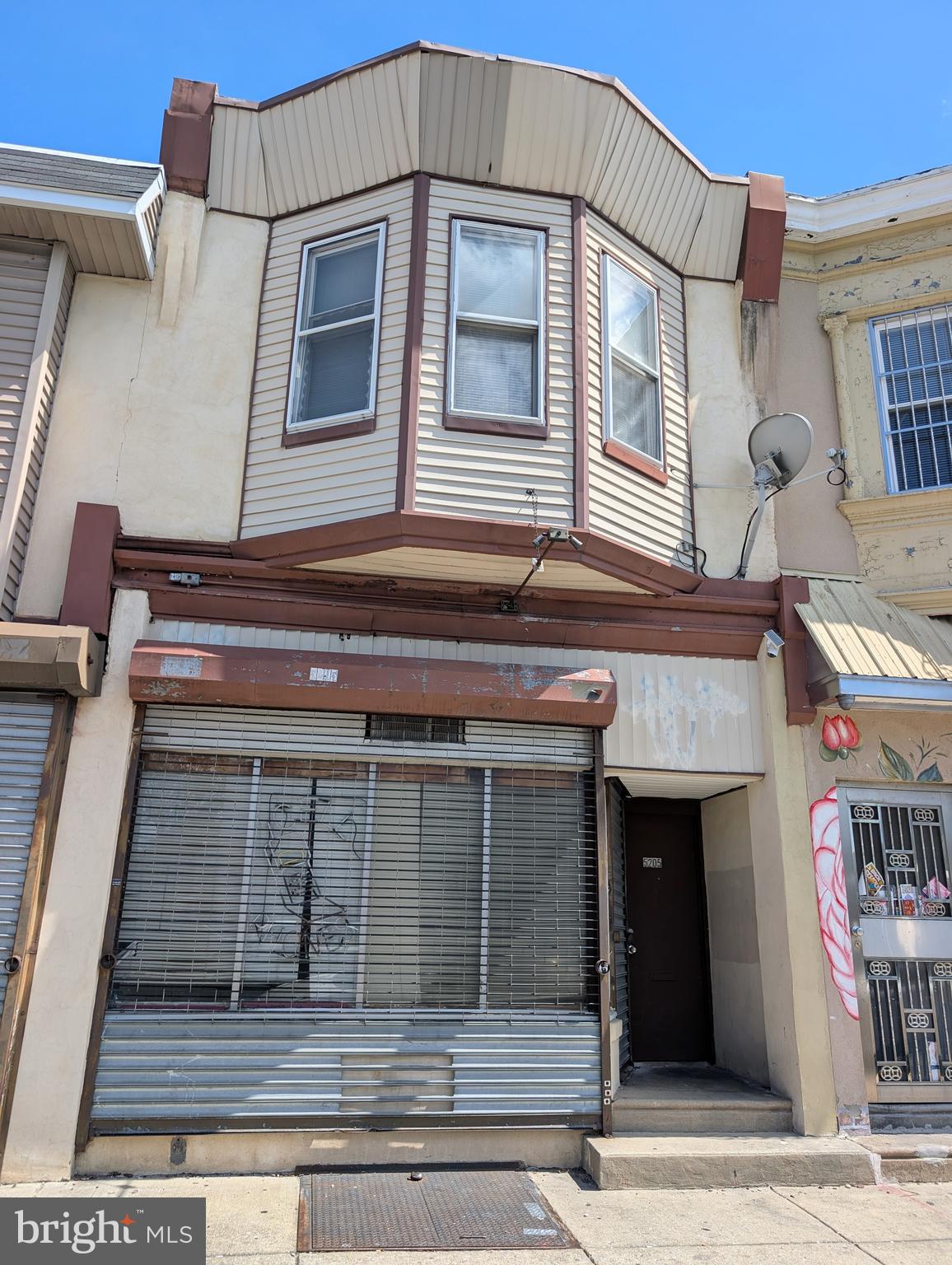 5205 North 5th Street, Unit 2F Philadelphia, PA 19120 - Photo 1 of 6 a view of a house with a door and a window