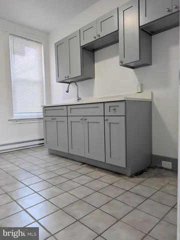 a kitchen with stainless steel appliances granite countertop a sink and a stove